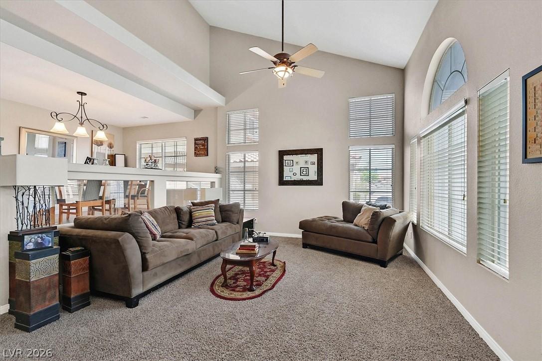Image 4: A vaulted ceiling, combined with a half-wall, crea