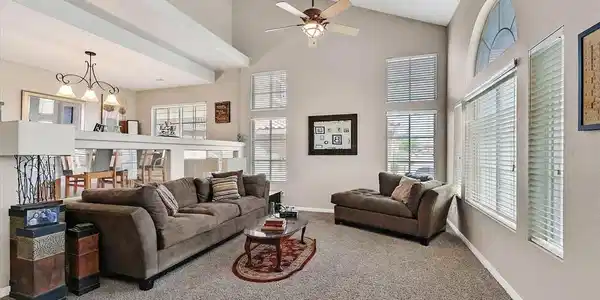 Image 4: A vaulted ceiling, combined with a half-wall, crea