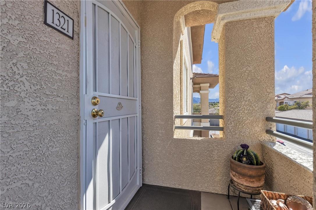 Image 3: Enter through a welcoming security door to a home