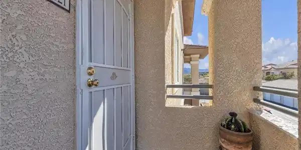 Image 3: Enter through a welcoming security door to a home