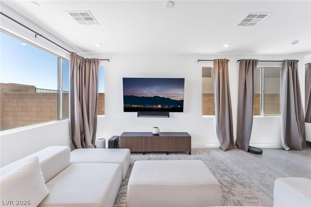 Image 4: An inviting family room with plush seating and swe