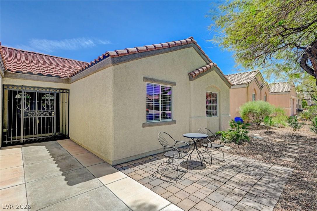 Image 4: A private entry courtyard leads to this charming d