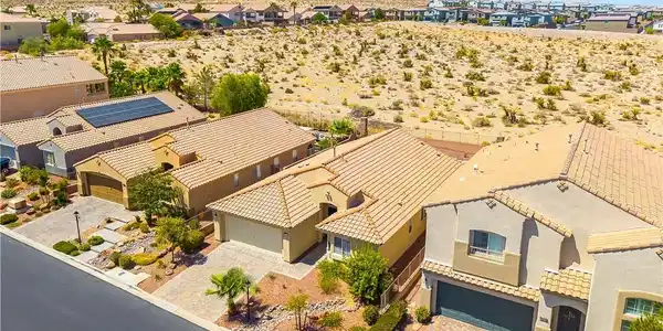 Image 3: An aerial perspective reveals a desert community w