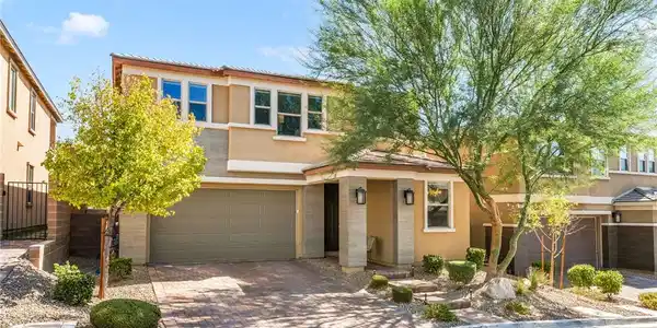 Image 2: Clean architectural lines and a paved driveway def