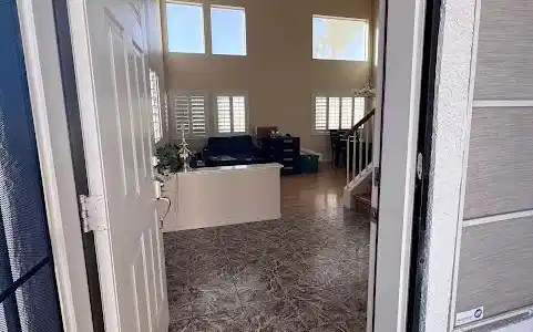 Image 2: An inviting entryway opens directly to tiled floor