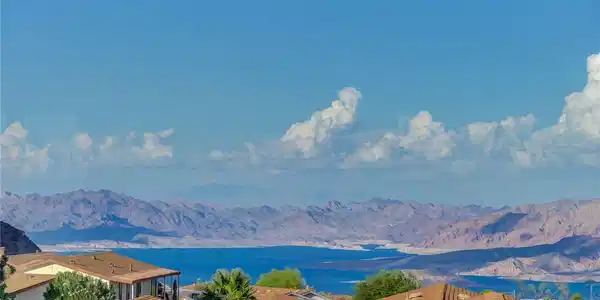 Image 2: Breathtaking mountain and water views rise above t