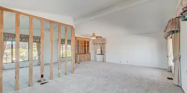 Image 4: Vaulted ceilings and broad carpeted floors define