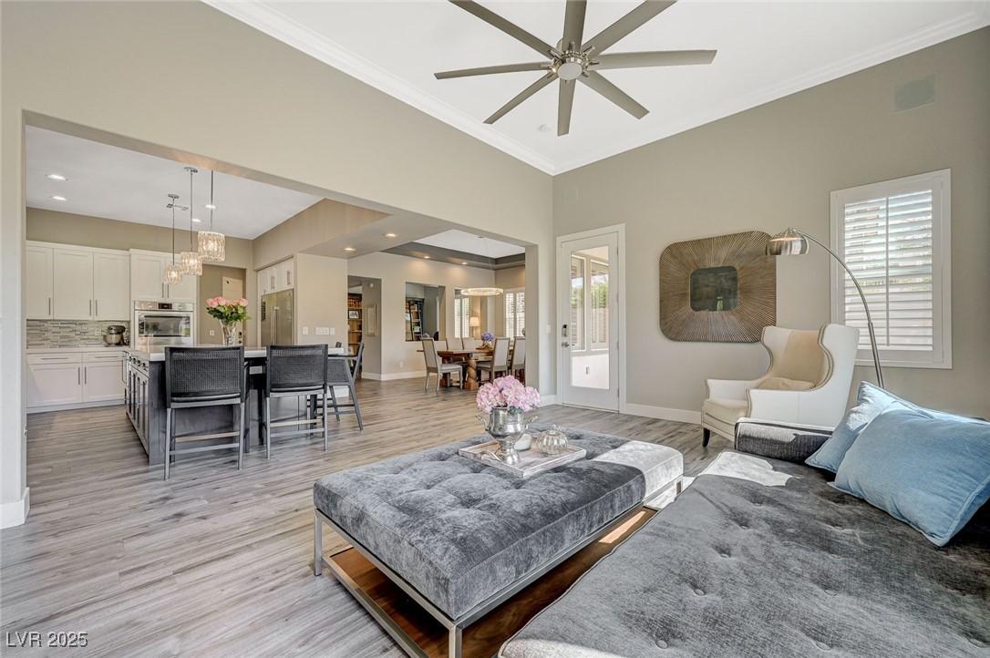 Image 4: Living area featuring crown molding, a wealth of n