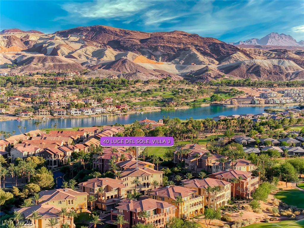 Image 4: An aerial perspective reveals a luxurious lakeside