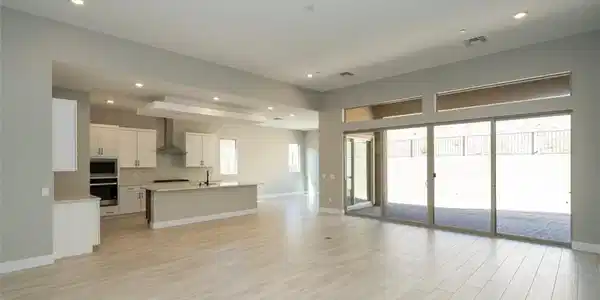 Image 2: Unfurnished living room with light wood-style floo