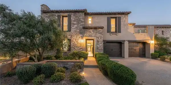Image 2: Natural stone and smooth stucco exterior walls cre