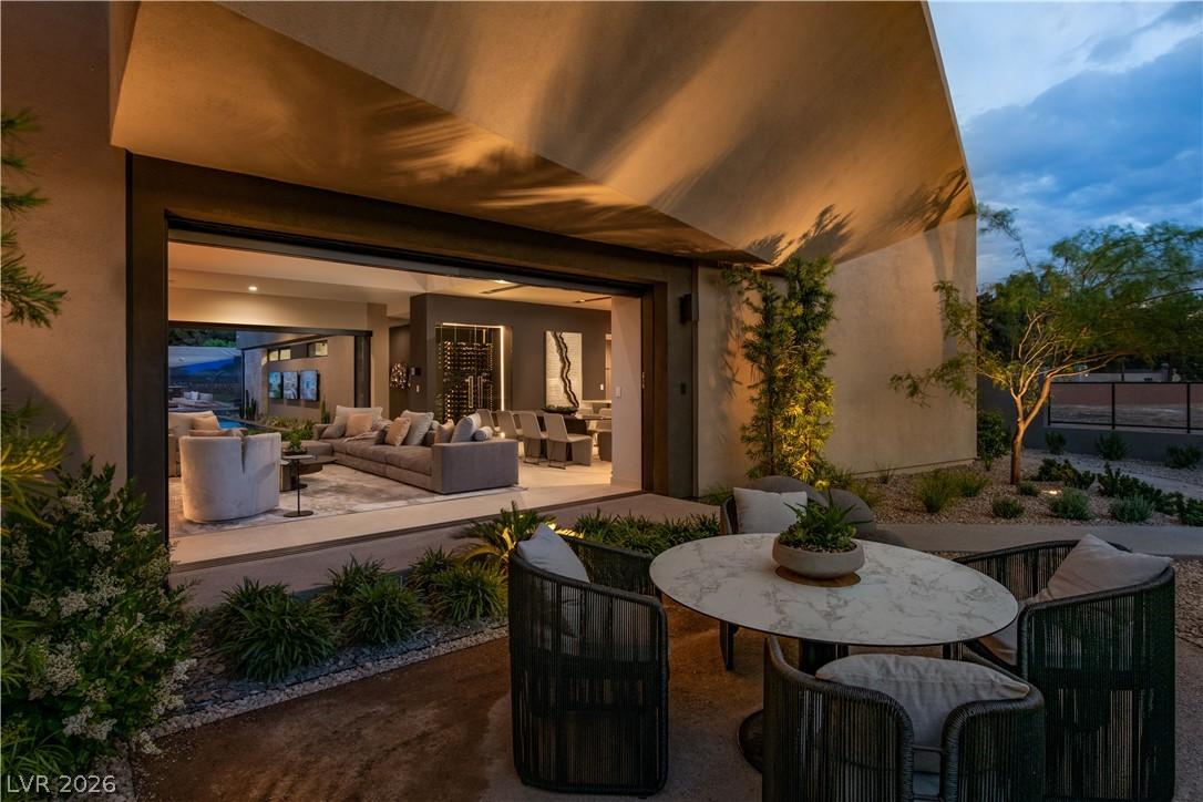 Image 4: An inviting outdoor seating area transitions seaml