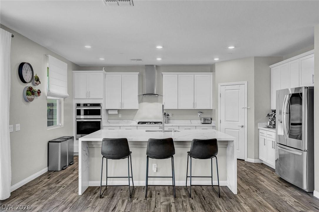 Image 3: This modern Kitchen boasts lots of white cabinetry