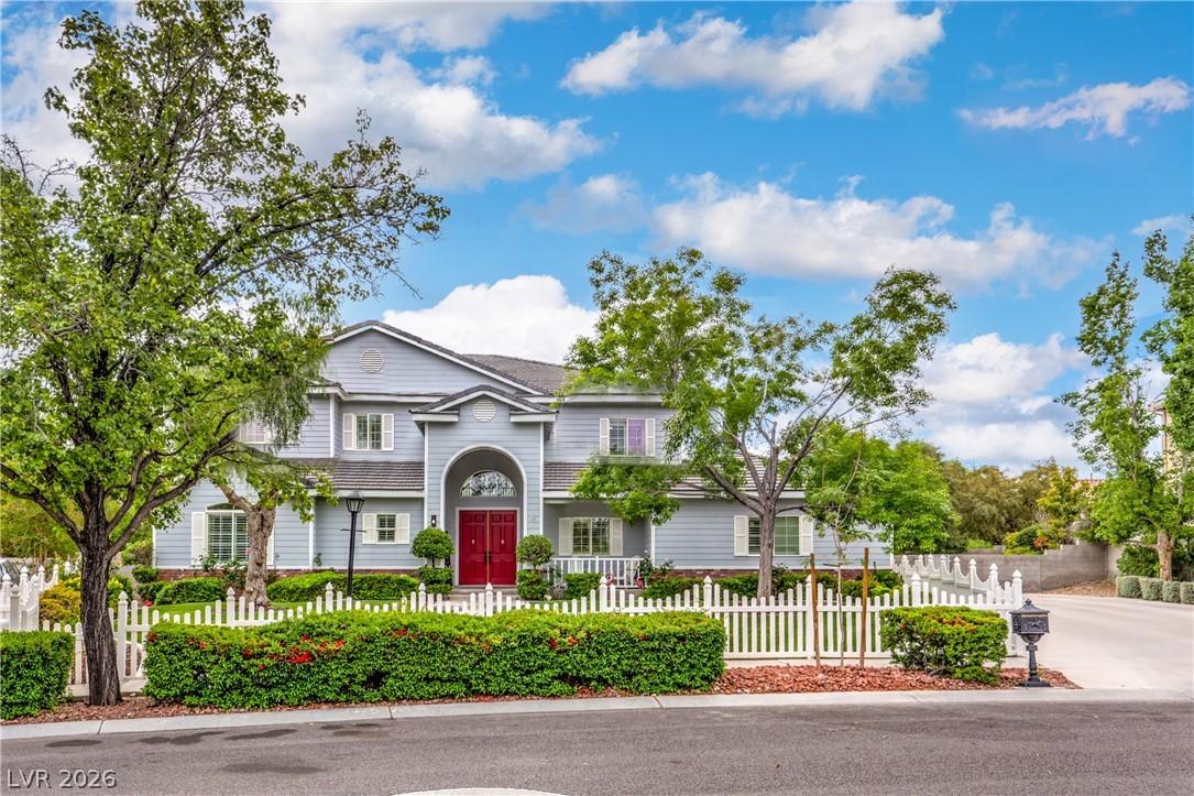 Image 2: This residence features a charming exterior with a