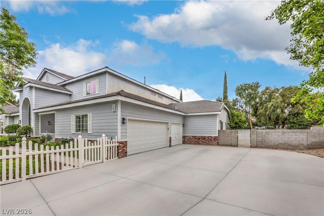 Image 4: This charming home features a well-manicured lawn