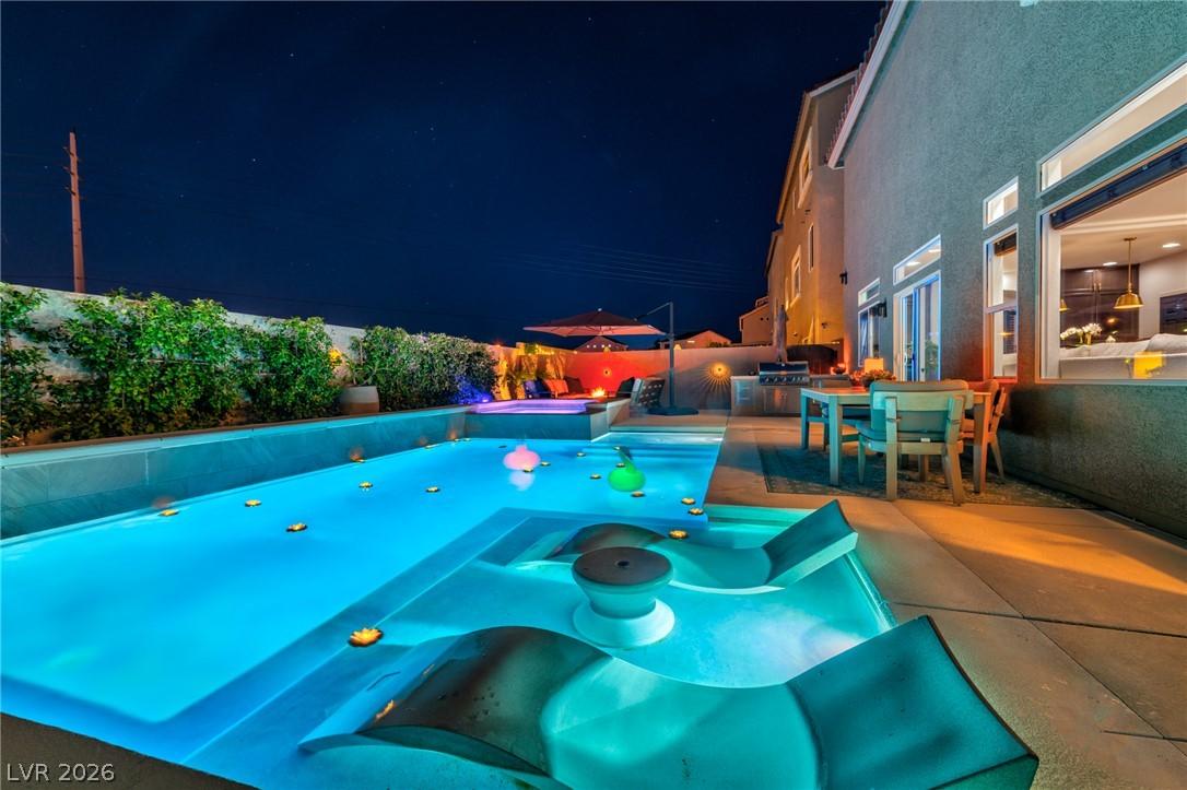 Image 3: An inviting pool area, perfect for evening enterta