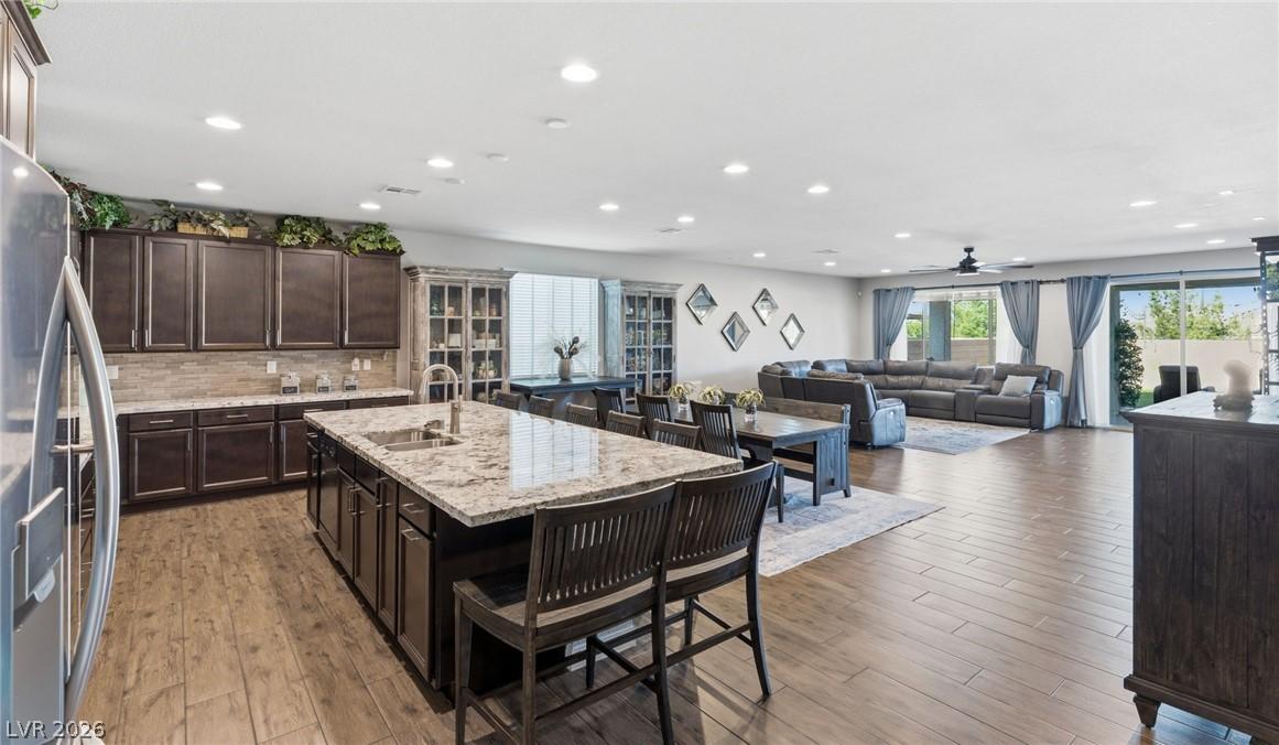 Image 4: An open concept living area seamlessly connects a