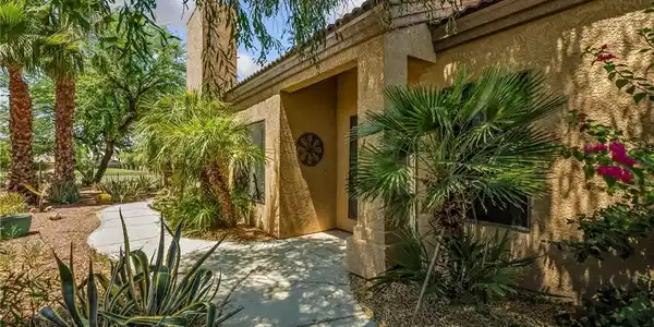 Image 4: A graceful pathway winds through desert landscapin