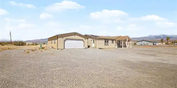 Image 3: A well-maintained single-story residence with an a