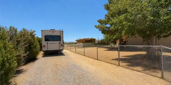 Image 3: A fenced yard provides secure outdoor living space