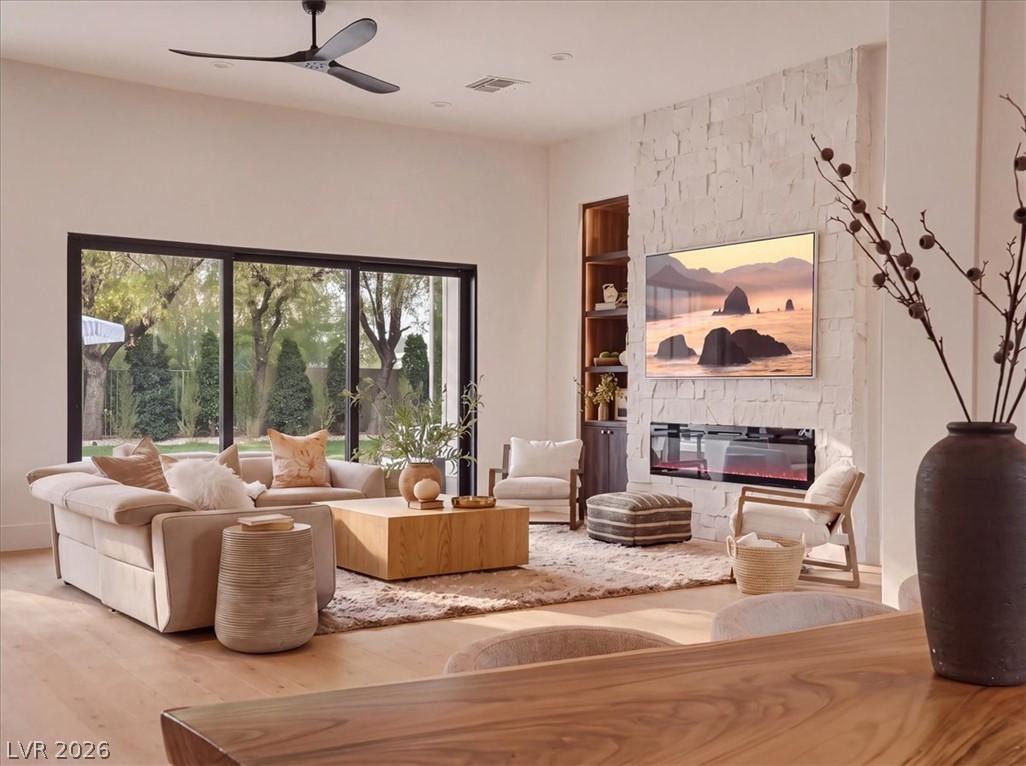 Image 2: A spacious living area features wide glass doors,