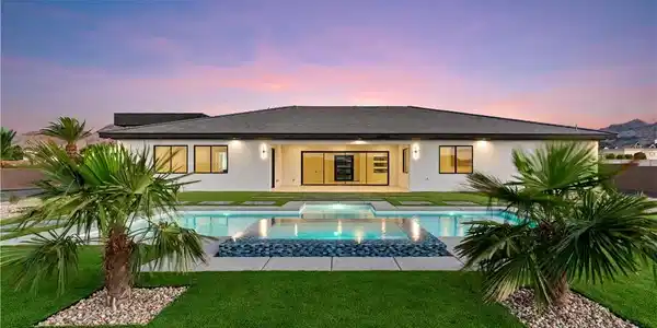 Image 2: An inviting backyard oasis showcases a pristine sw