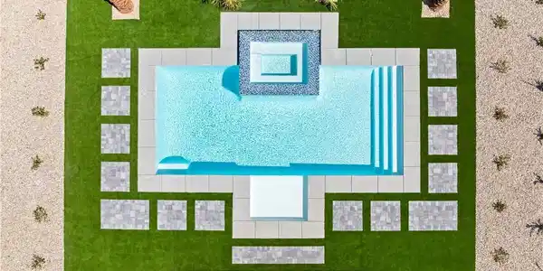 Image 3: Geometric paver designs and artificial turf surrou