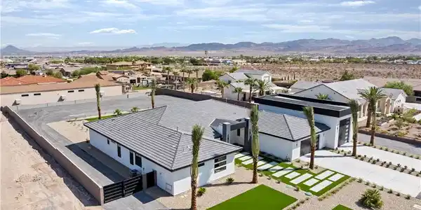 Image 4: Clean lines and manicured desert landscaping defin
