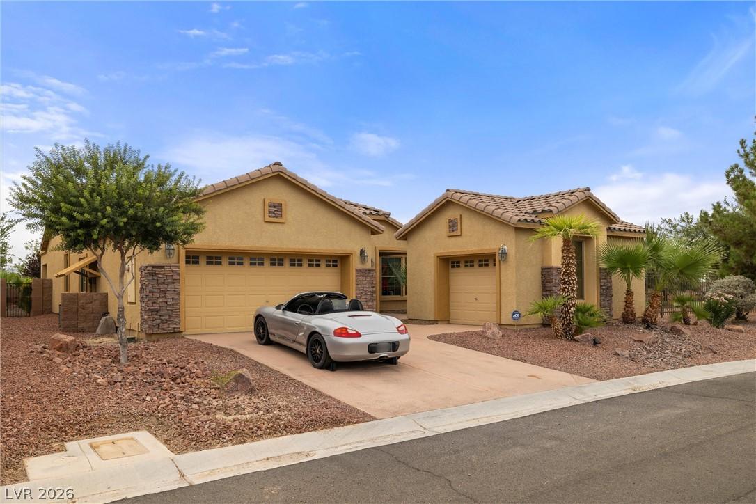 Image 2: This desert oasis features a multi-car garage and