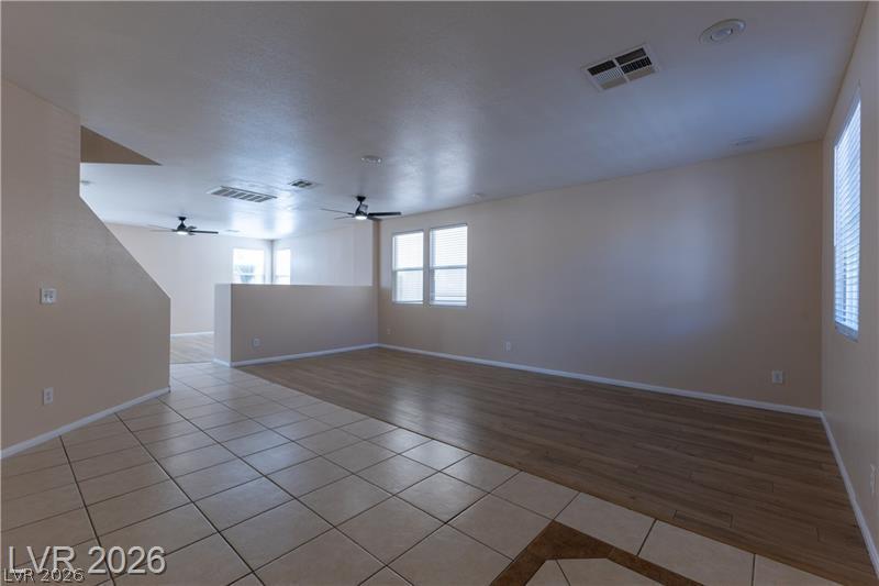 Image 2: An inviting open-concept living space features dua