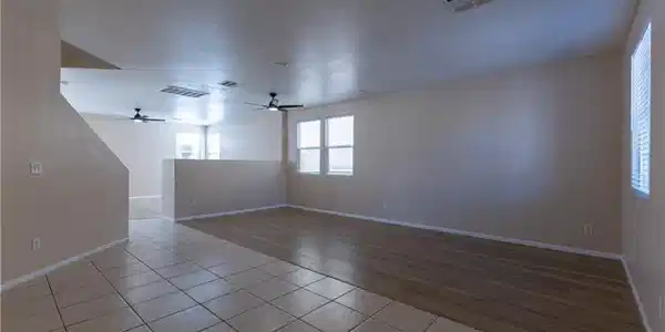 Image 2: An inviting open-concept living space features dua