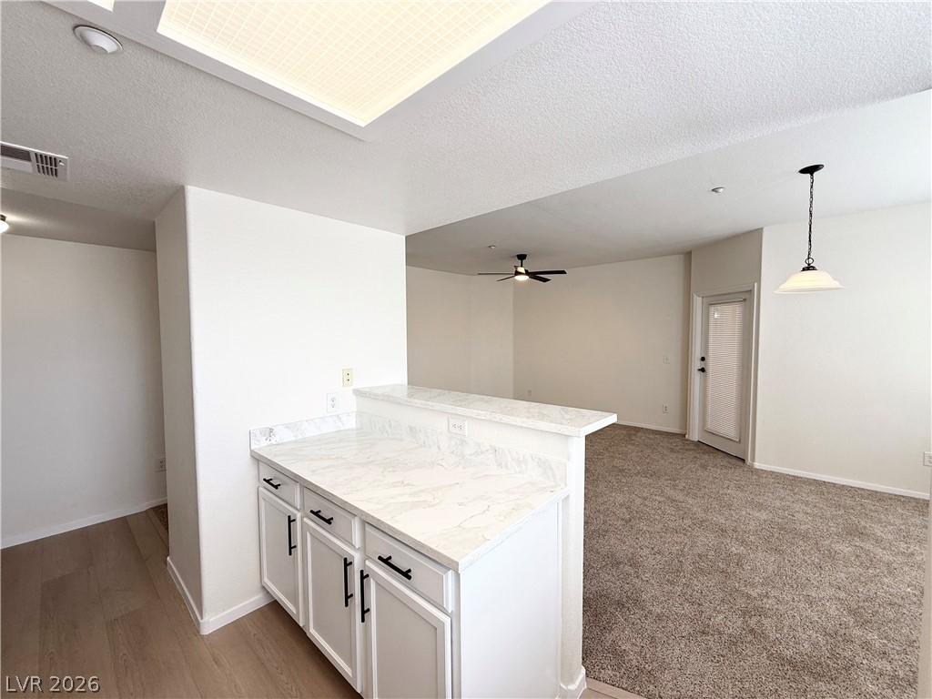 Image 2: This bright, open space features modern finishes a