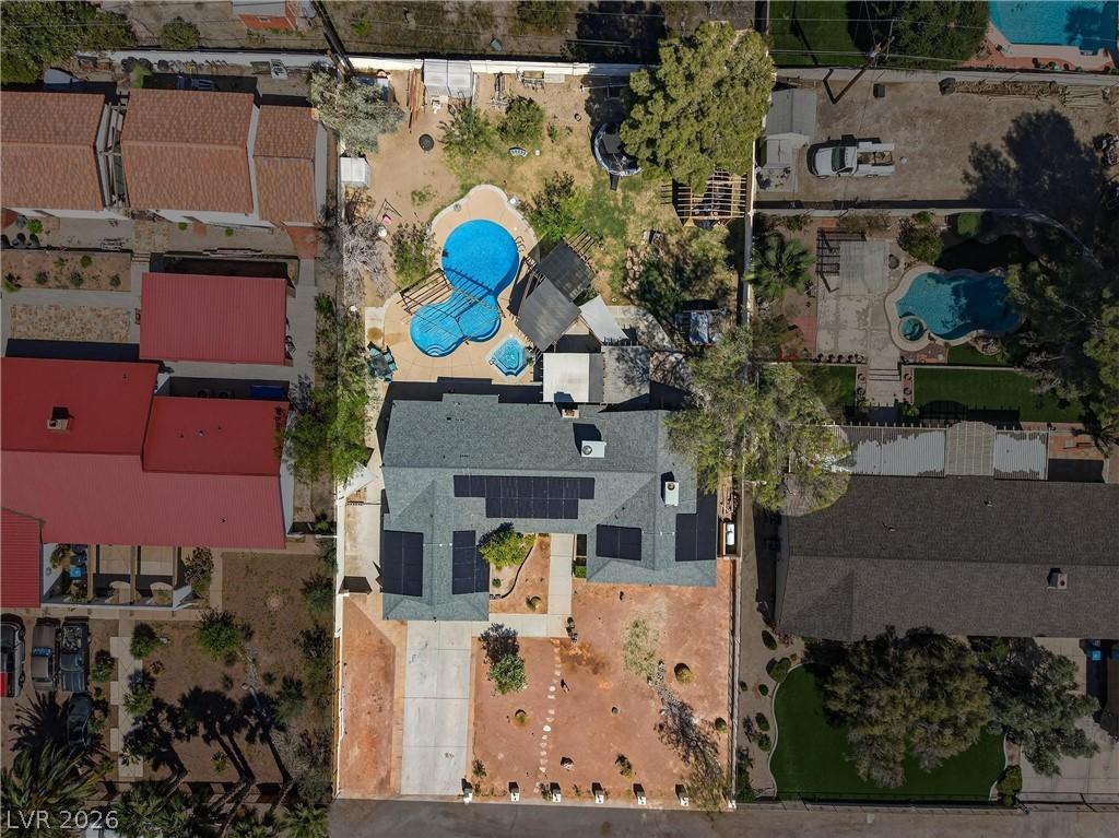 Image 2: An aerial perspective reveals a private pool and s