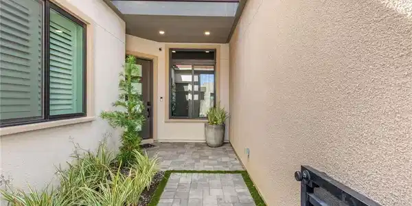 Image 3: Welcoming stone paver pathway leads directly to a