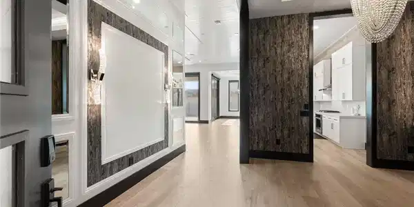 Image 4: Gleaming hardwood floors and a statement chandelie