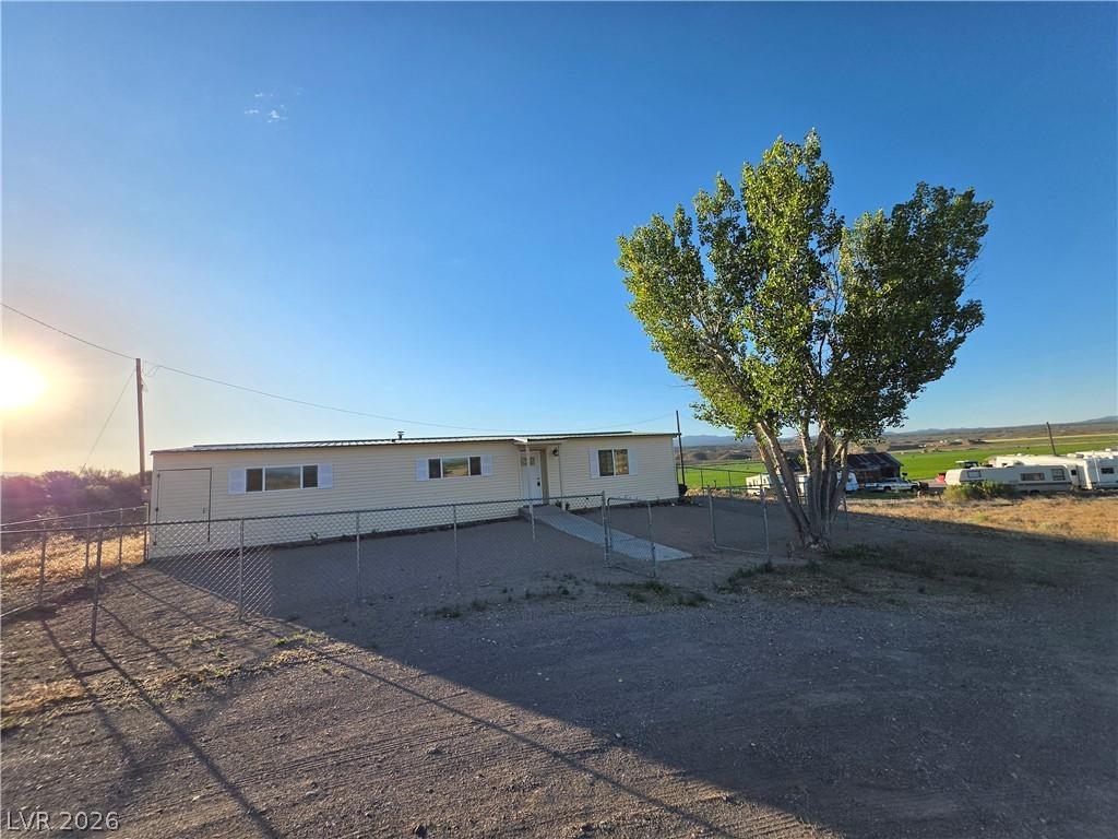 Image 3: A pleasant home with a chain-link fence and a larg