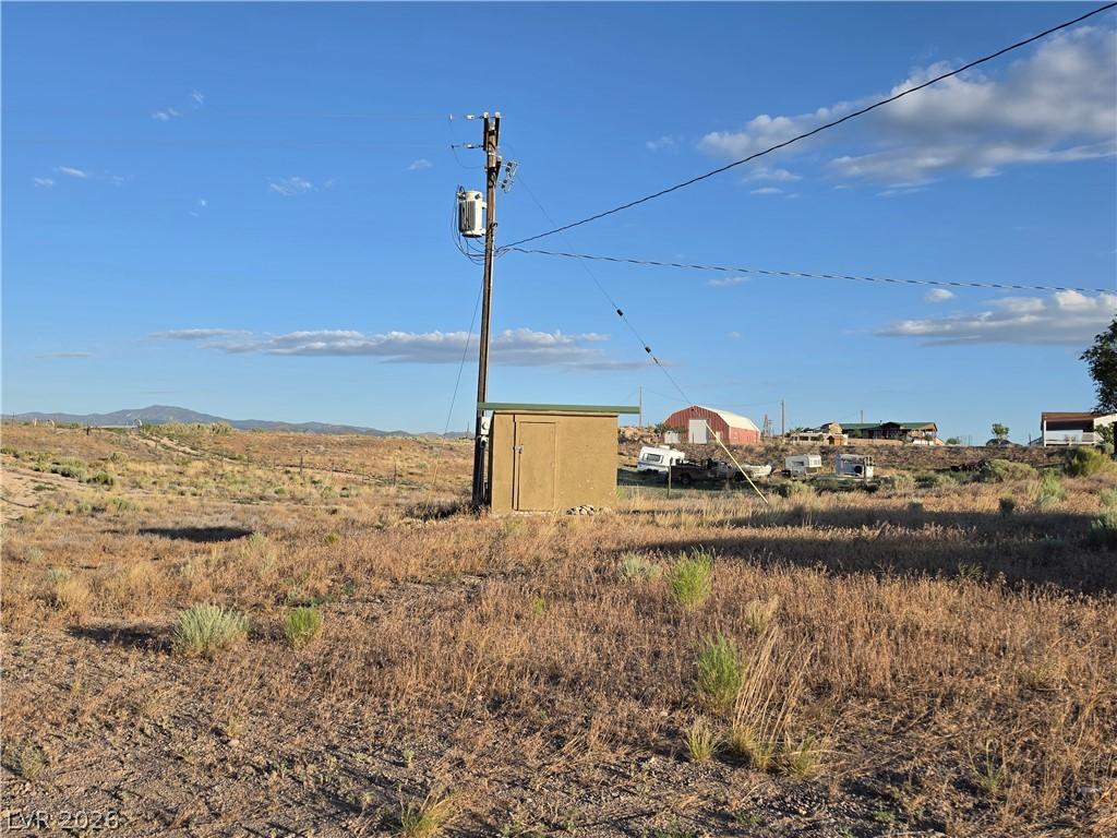 Image 4: A rural setting offers expansive land with a clear