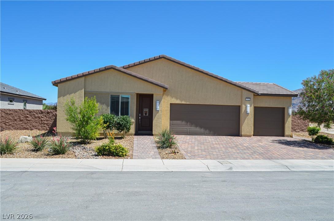 Image 1: A desert oasis awaits with this charming stucco ho