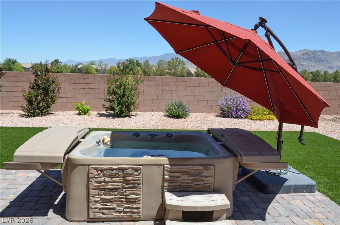Image 3: An inviting private spa area with a stone-clad hot