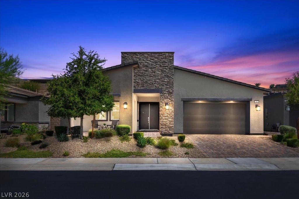 Image 2: Modern desert home with a charming stone facade an