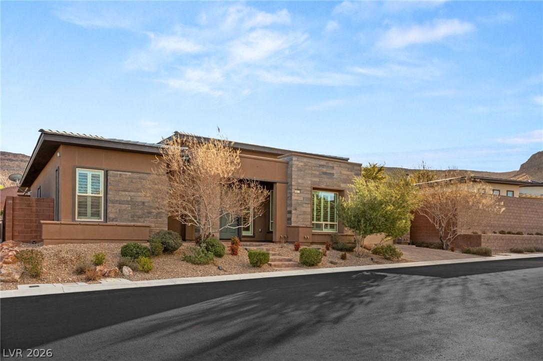 Image 2: A modern desert dwelling with stacked stone accent