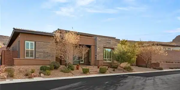 Image 2: A modern desert dwelling with stacked stone accent