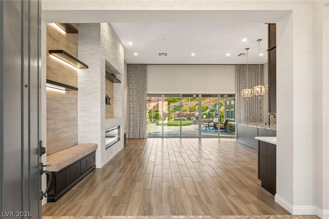 Image 3: Enter into a bright living space featuring modern