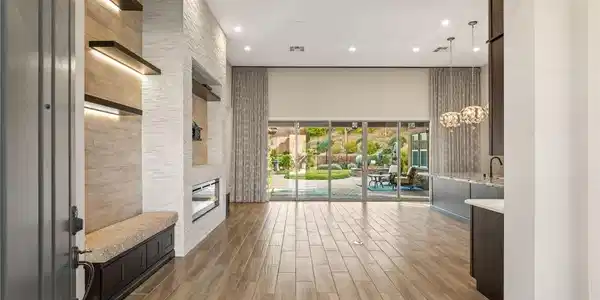 Image 3: Enter into a bright living space featuring modern