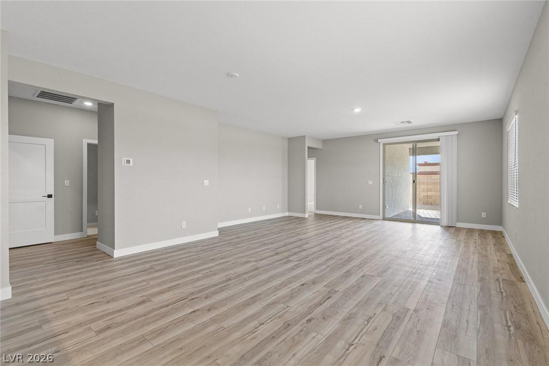 Image 3: An open-concept living area provides ample space f