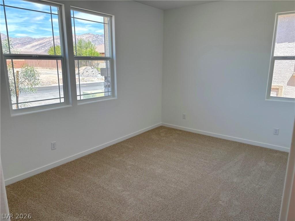 Image 4: Spare room featuring carpet and a mountain view