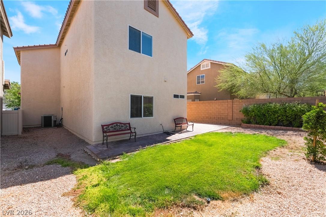 Image 3: A modest backyard provides ample space for relaxat