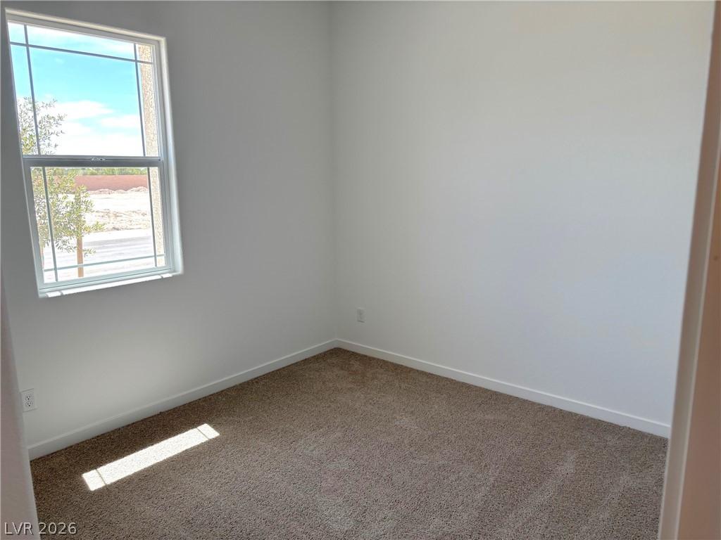 Image 4: Carpeted empty room featuring baseboards