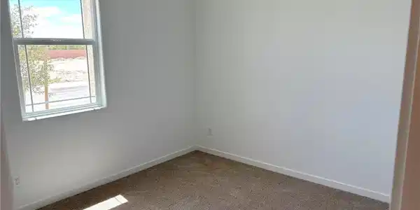 Image 4: Carpeted empty room featuring baseboards