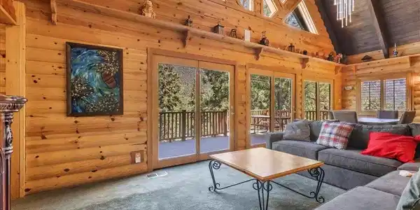 Image 4: Wrapped in rich knotty pine log siding inside & ou